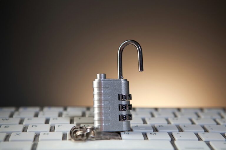 Open padlock with combination lock on keyboard